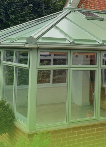 A Green Space UK conservatory roof with pale green panels 