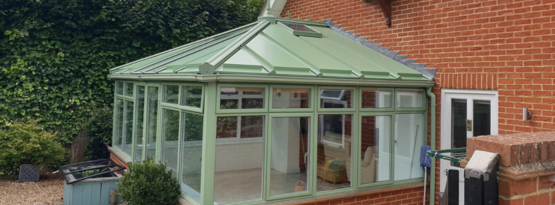 A Green Space UK conservatory roof with pale green panels 